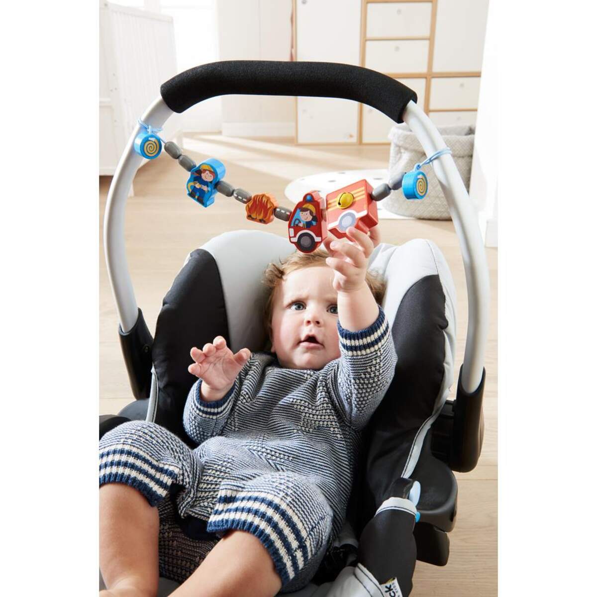 HABA 304633 Kinderwagenkette Feuerwehrauto